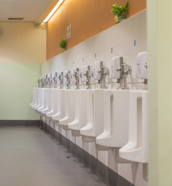 a row of urinals in a public bathroom in Sydney